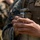 Marines with 3rd Intelligence Battalion throw grenades during a field exercise.