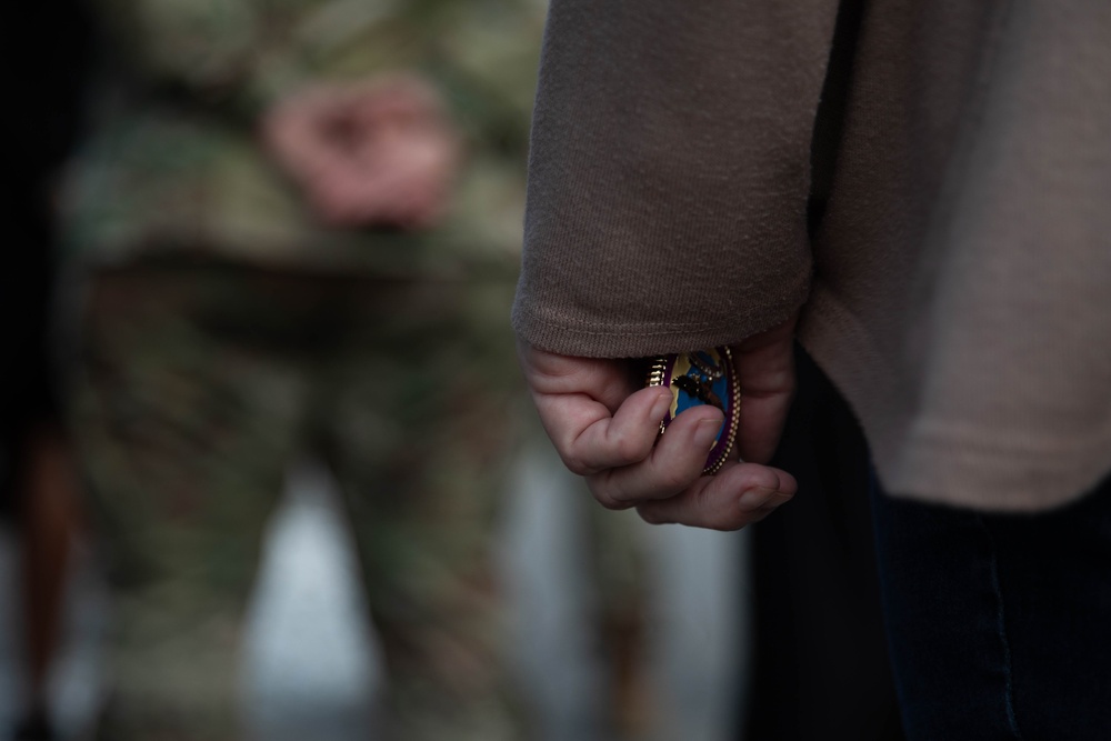 Vice Adm. Thomas Ishee presents coins to members of SETAF-AF