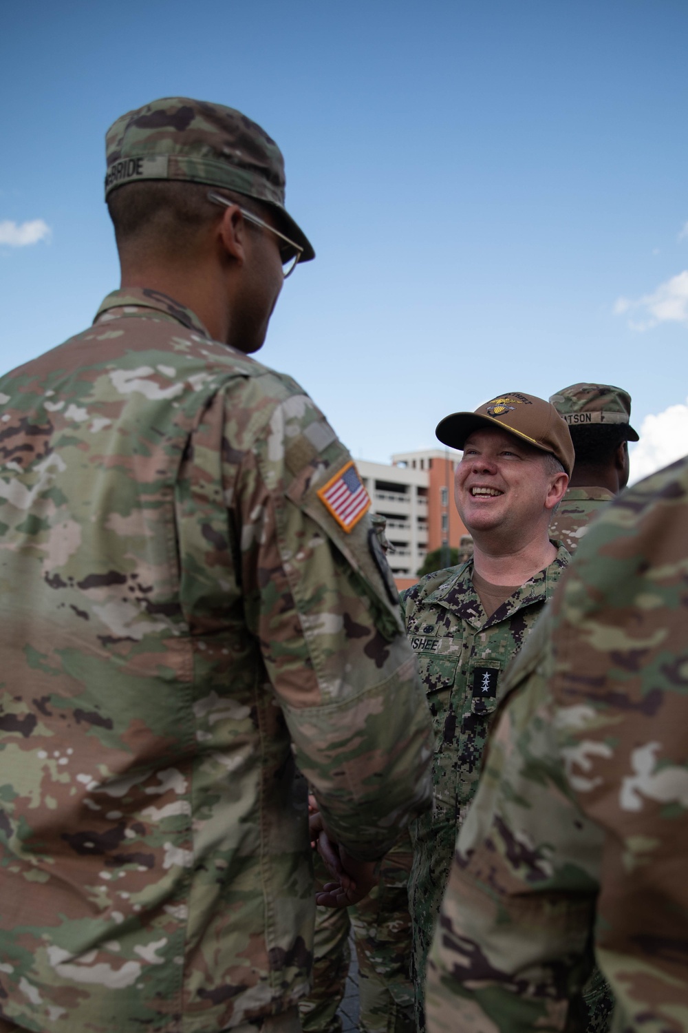 Vice Adm. Thomas Ishee presents coins to members of SETAF-AF