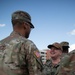 Vice Adm. Thomas Ishee presents coins to members of SETAF-AF