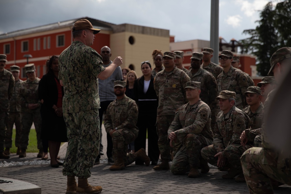 Vice Adm. Thomas Ishee presents coins to members of SETAF-AF