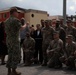 Vice Adm. Thomas Ishee presents coins to members of SETAF-AF