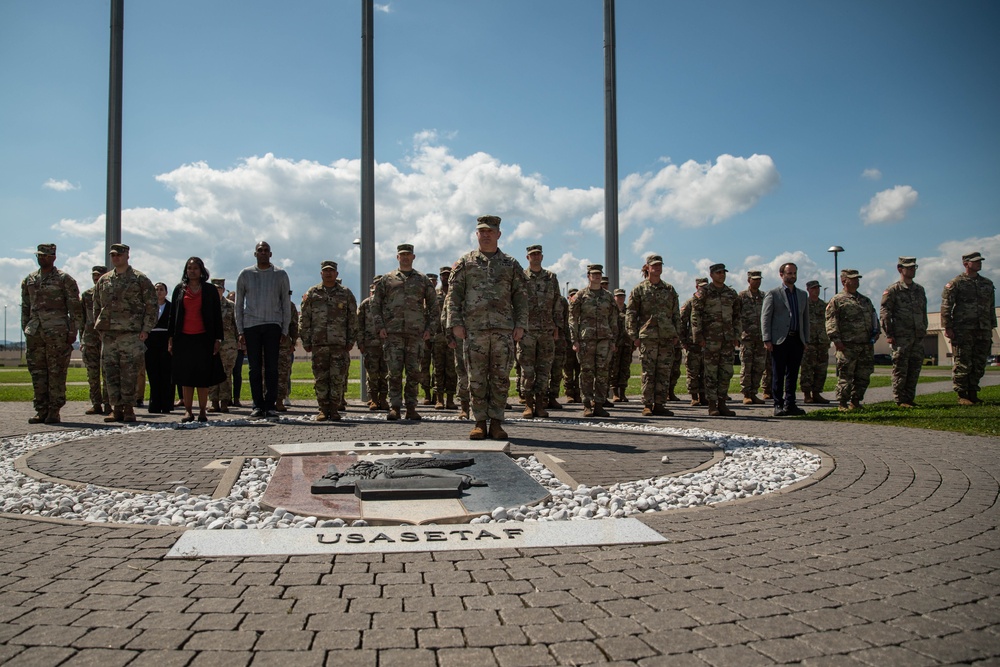 Vice Adm. Thomas Ishee presents coins to members of SETAF-AF