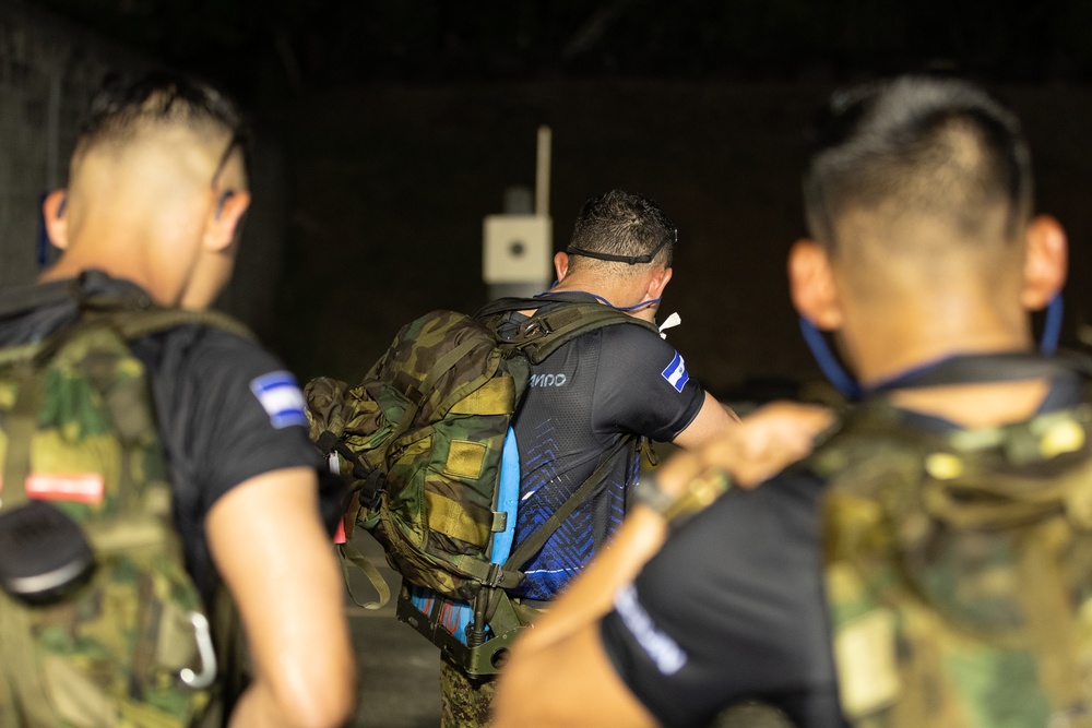 Competitors take part in Fuerzas Comando 2024 Night Ruck March