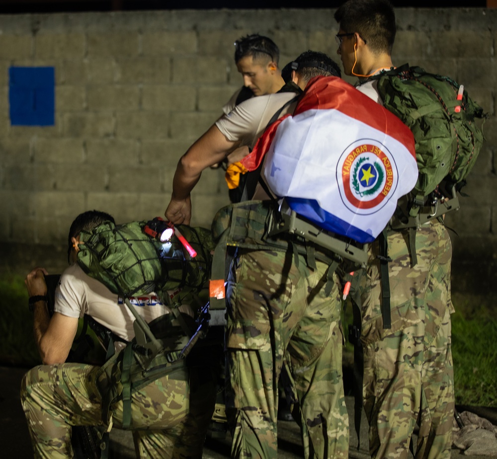 Competitors take part in Fuerzas Comando 2024 Night Ruck March