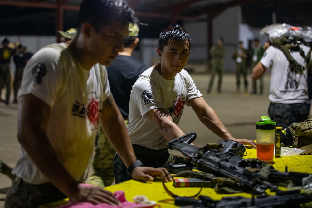 Competitors take part in Fuerzas Comando 2024 Night Ruck March