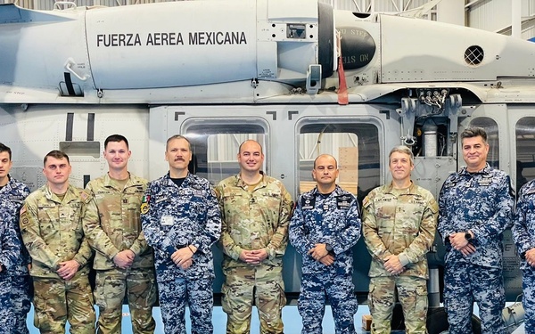 Experts from Army North and Furze Aérea Mexican 108th and 107th UH-60M helicopter squadrons participate in rescue hoist maintenance and operations exchange