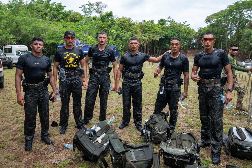 Competitors take part in Fuerzas Comando 24 Aquatic Run-and-Shoot Event