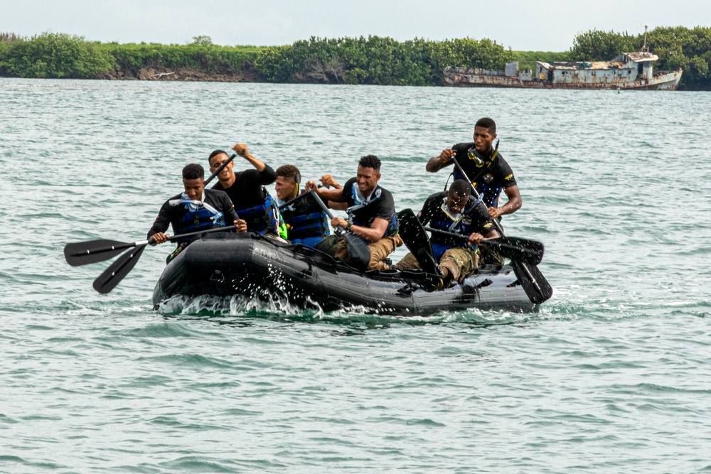 Competitors take part in Fuerzas Comando 24 Aquatic Run-and-Shoot Event