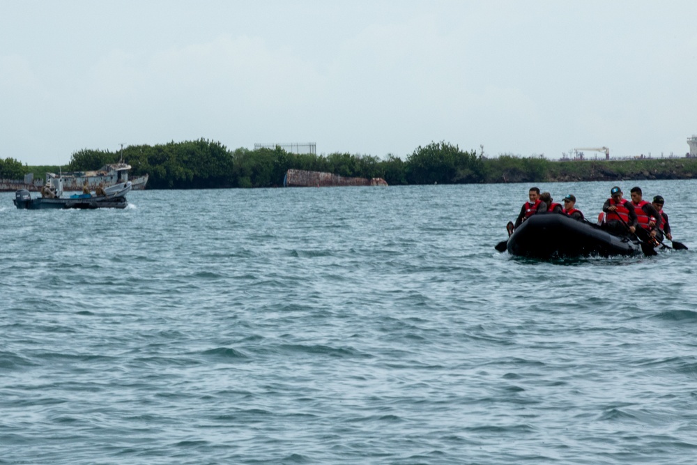 Competitors take part in Fuerzas Comando 24 Aquatic Run-and-Shoot Event