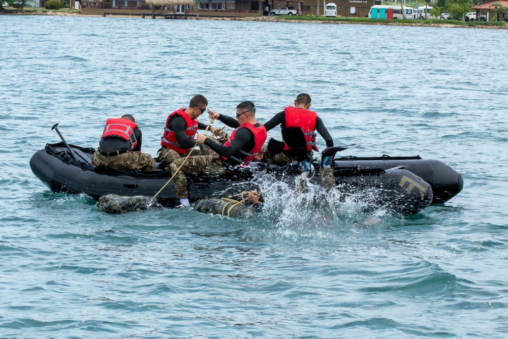 Competitors take part in Fuerzas Comando 24 Aquatic Run-and-Shoot Event