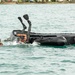 Competitors take part in Fuerzas Comando 24 Aquatic Run-and-Shoot Event