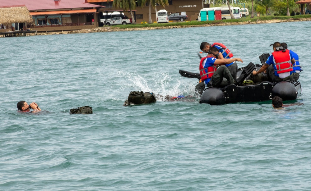 Competitors take part in Fuerzas Comando 24 Aquatic Run-and-Shoot Event