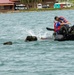 Competitors take part in Fuerzas Comando 24 Aquatic Run-and-Shoot Event