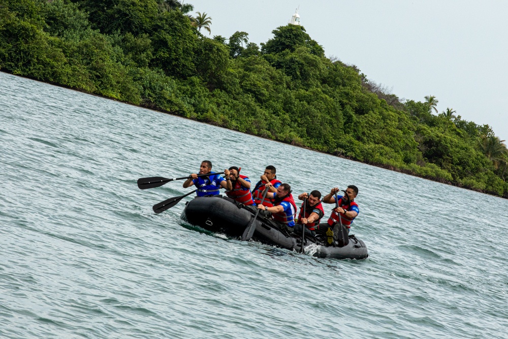 Competitors take part in Fuerzas Comando 24 Aquatic Run-and-Shoot Event