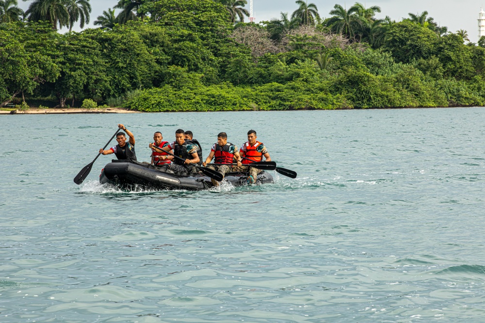 Competitors take part in Fuerzas Comando 24 Aquatic Run-and-Shoot Event