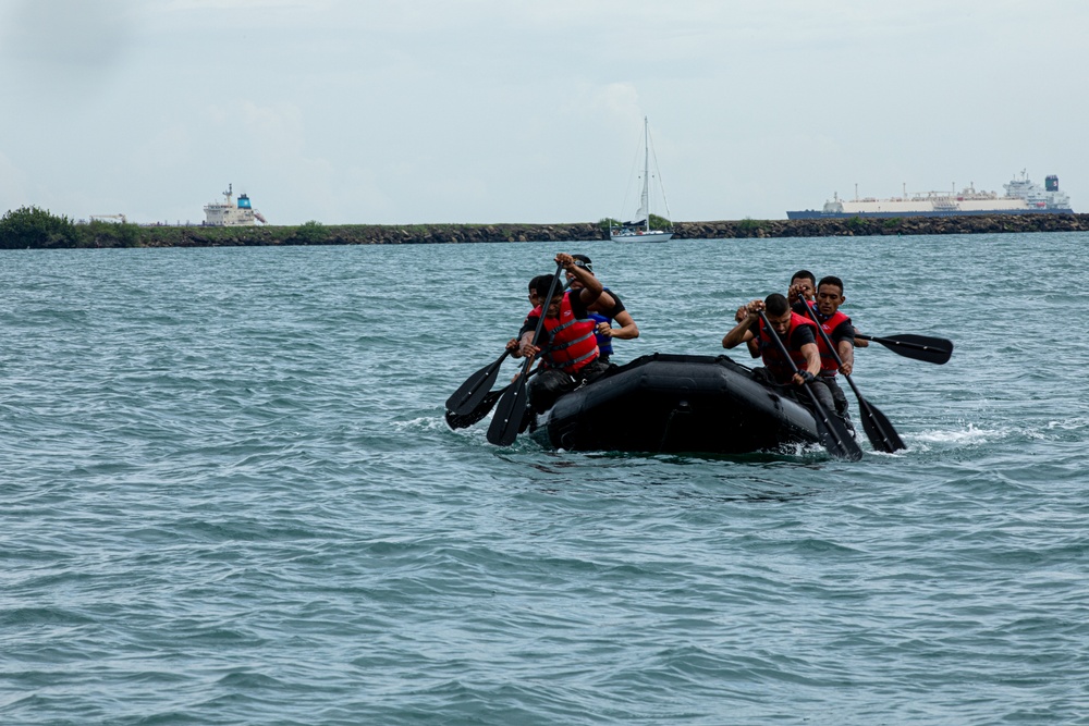 Competitors take part in Fuerzas Comando 24 Aquatic Run-and-Shoot Event