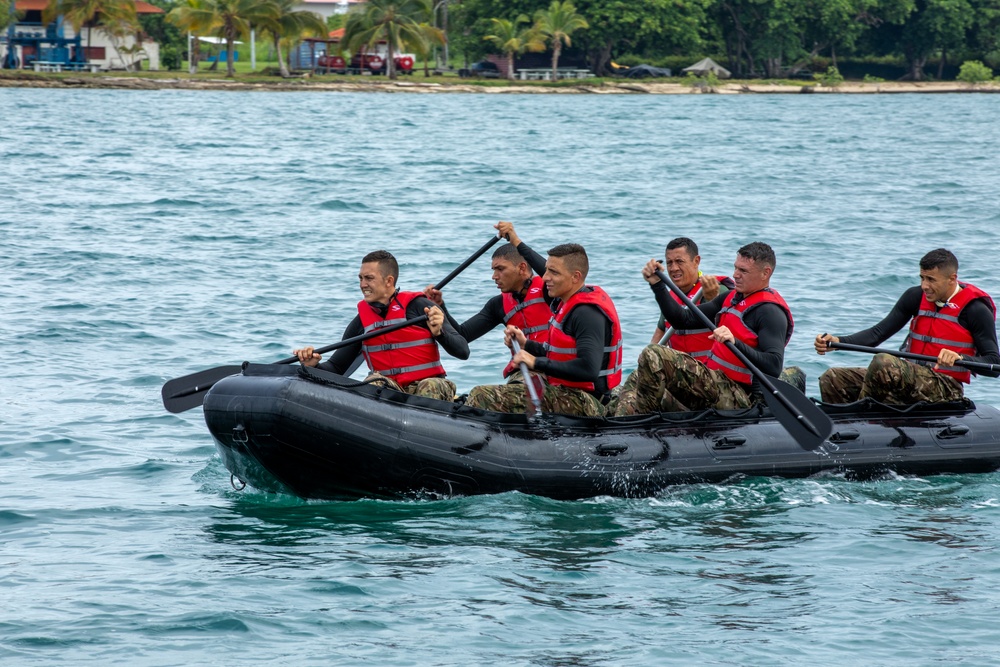 Competitors take part in Fuerzas Comando 24 Aquatic Run-and-Shoot Event