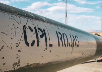 Field Artillery Soldiers Honor Fallen Soldiers on Howitzer Cannons