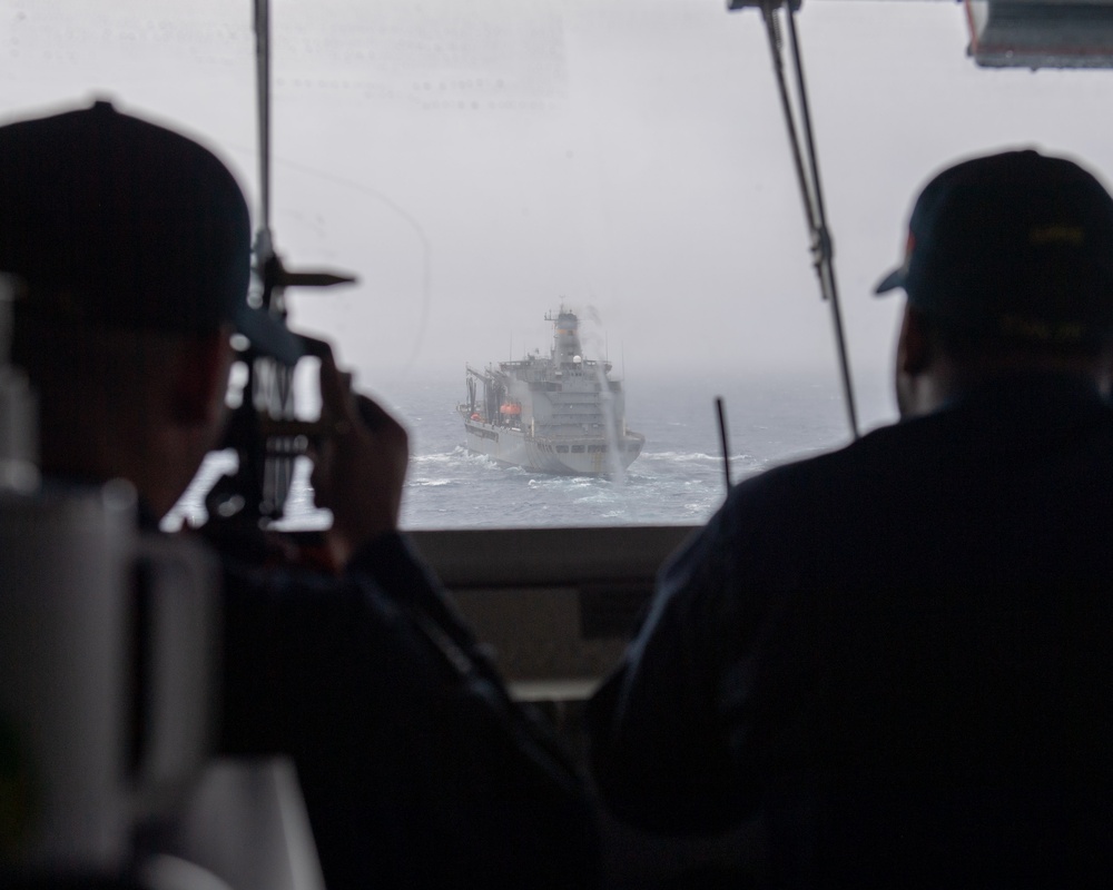USS Ronald Reagan (CVN 76) conducts a replenishment-at-sea and fueling-at-sea with USNS John Ericsson (T-AO-194) and USNS Charles Drew (T-AKE 10)
