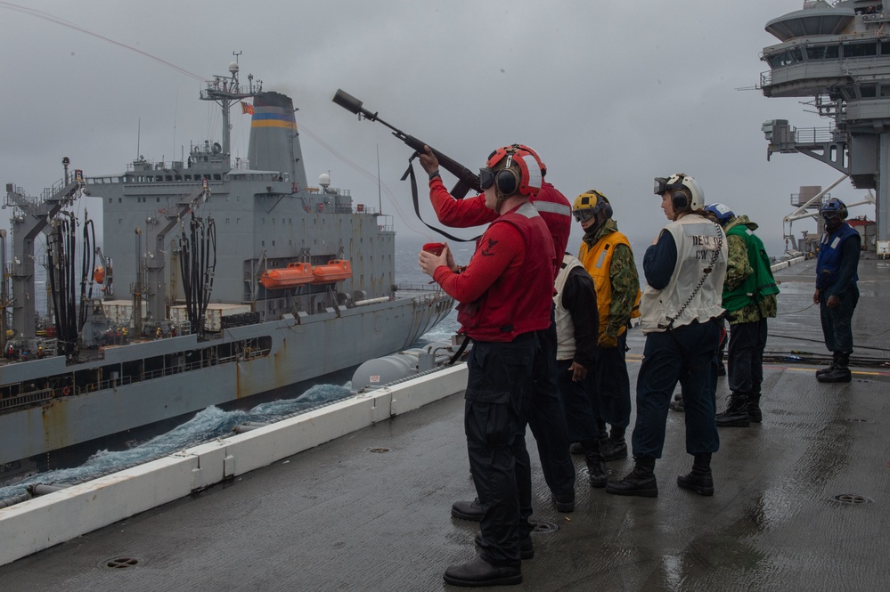 USS Ronald Reagan (CVN 76) conducts a replenishment-at-sea and fueling-at-sea with USNS John Ericsson (T-AO-194) and USNS Charles Drew (T-AKE 10)