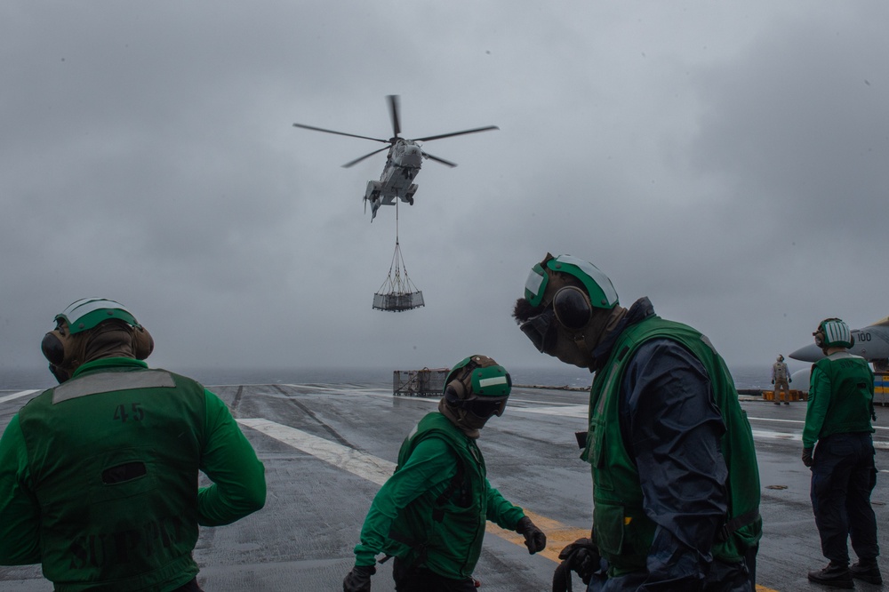 USS Ronald Reagan (CVN 76) conducts a replenishment-at-sea and fueling-at-sea with USNS John Ericsson (T-AO-194) and USNS Charles Drew (T-AKE 10)