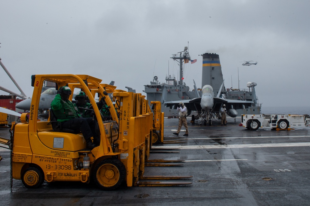 USS Ronald Reagan (CVN 76) conducts a replenishment-at-sea and fueling-at-sea with USNS John Ericsson (T-AO-194) and USNS Charles Drew (T-AKE 10)