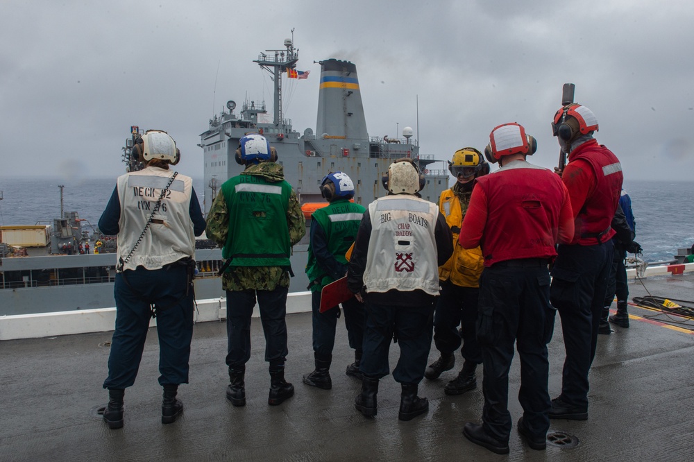 USS Ronald Reagan (CVN 76) conducts a replenishment-at-sea and fueling-at-sea with USNS John Ericsson (T-AO-194) and USNS Charles Drew (T-AKE 10)