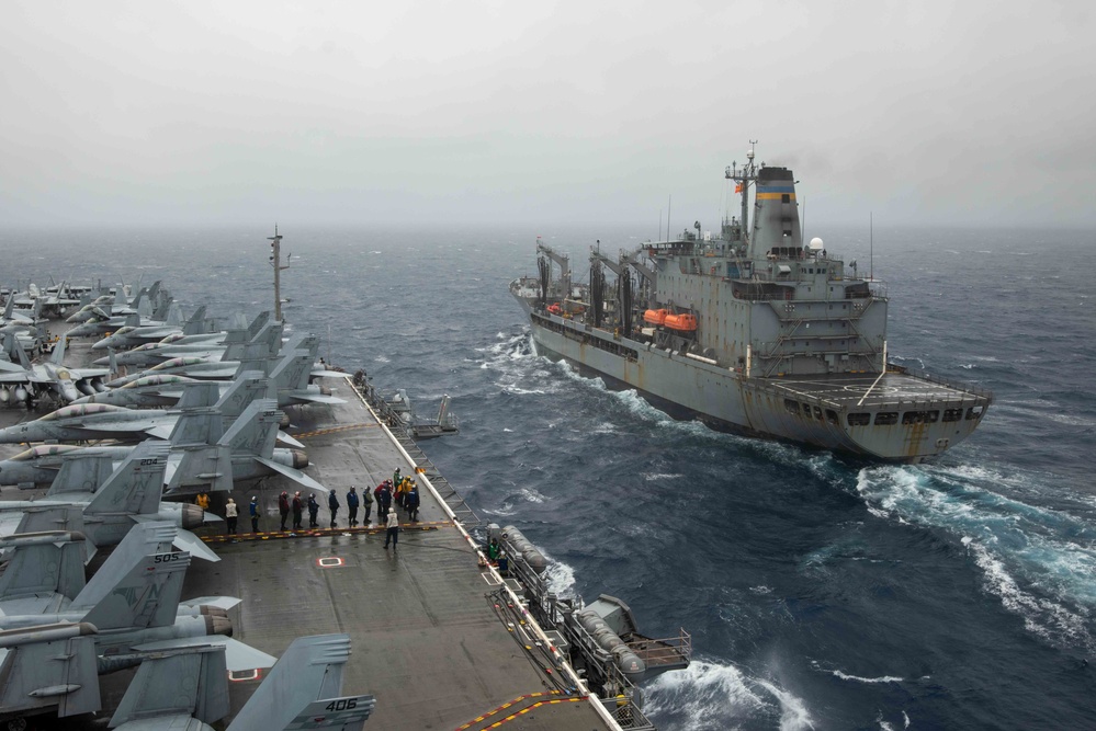 USS Ronald Reagan (CVN 76) conducts a replenishment-at-sea and a fueling-at-sea with USNS Charles Drew and USNS John Ericsson