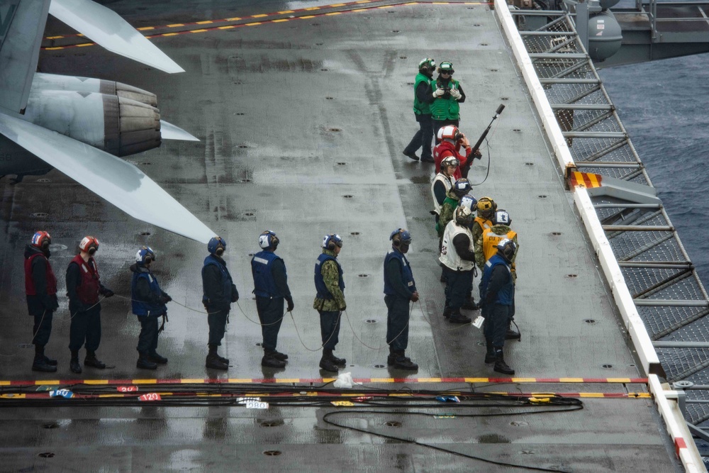 USS Ronald Reagan (CVN 76) conducts a replenishment-at-sea and a fueling-at-sea with USNS Charles Drew and USNS John Ericsson