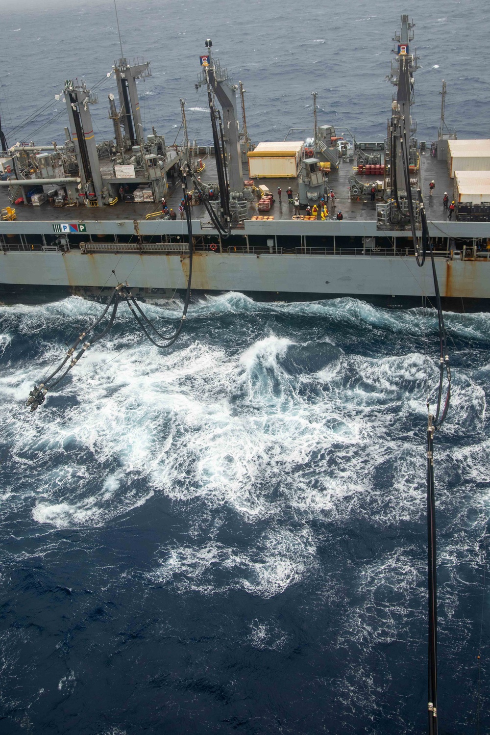 USS Ronald Reagan (CVN 76) conducts a replenishment-at-sea and a fueling-at-sea with USNS Charles Drew and USNS John Ericsson