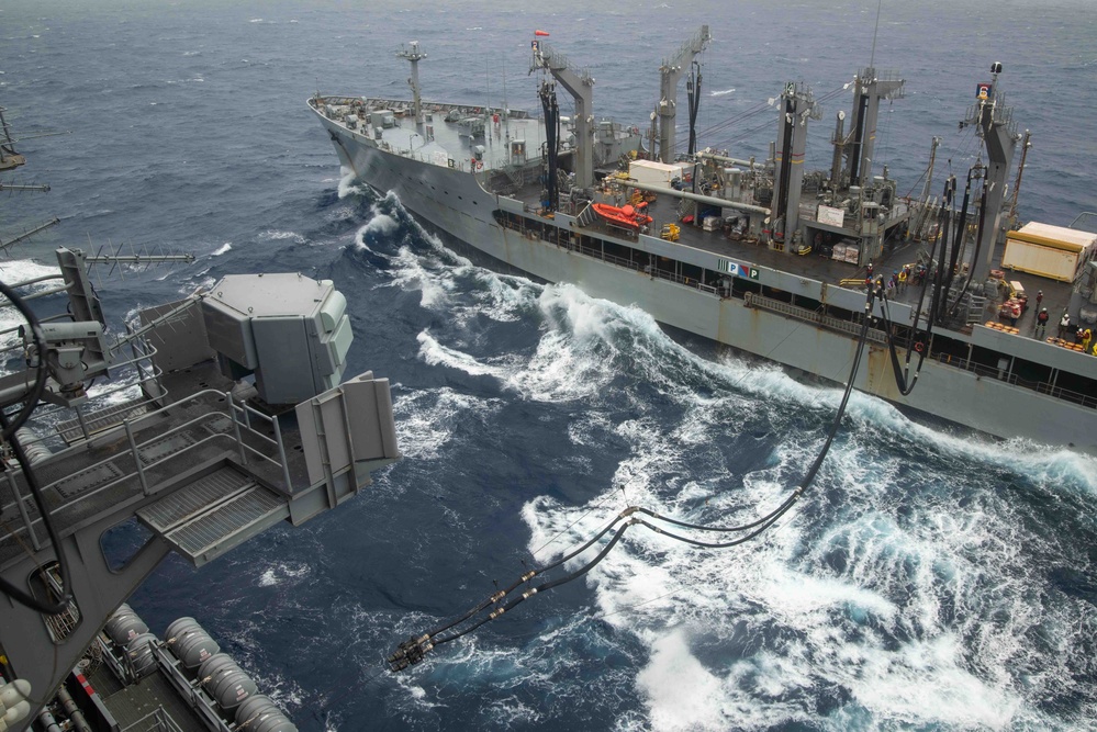 USS Ronald Reagan (CVN 76) conducts a replenishment-at-sea and a fueling-at-sea with USNS Charles Drew and USNS John Ericsson