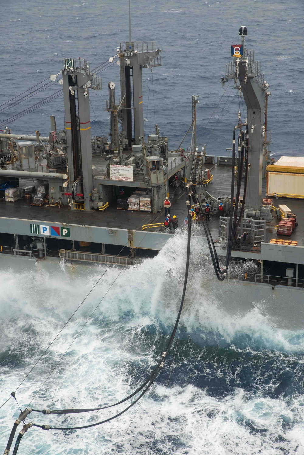 USS Ronald Reagan (CVN 76) conducts a replenishment-at-sea and a fueling-at-sea with USNS Charles Drew and USNS John Ericsson