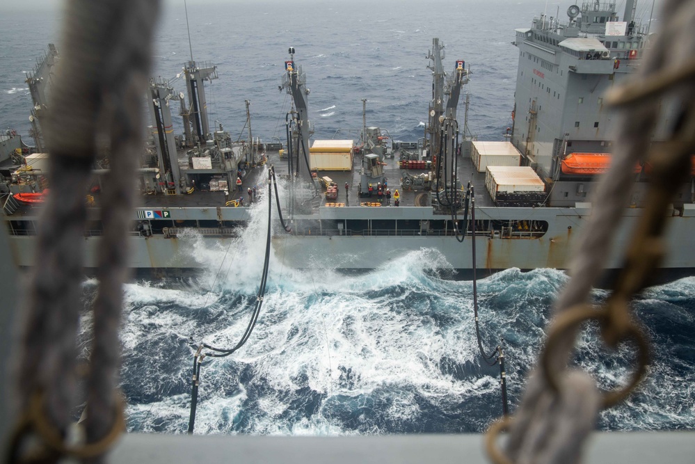 USS Ronald Reagan (CVN 76) conducts a replenishment-at-sea and a fueling-at-sea with USNS Charles Drew and USNS John Ericsson
