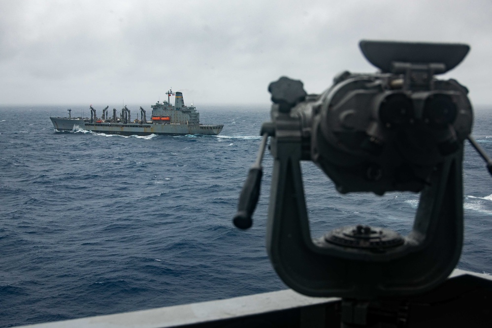 USS Ronald Reagan (CVN 76) conducts a replenishment-at-sea and a fueling-at-sea with USNS Charles Drew and USNS John Ericsson