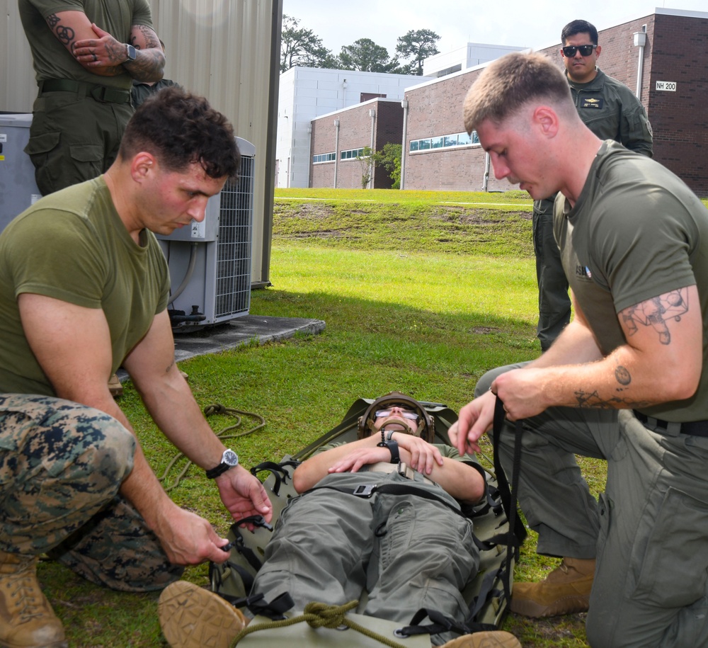 Sailors attend litter bearing/casualty assessment training course held by en-route care corpsmen assigned to 2nd Medical Battalion