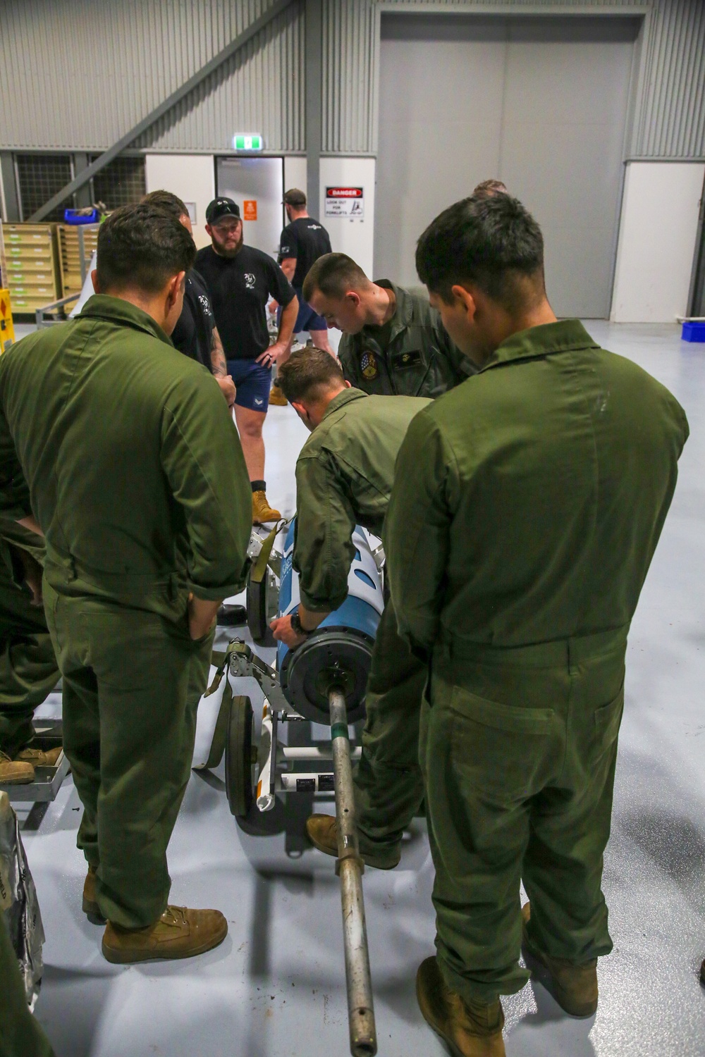 U.S. Marines and Australian Airmen Build Inert Bombs Together