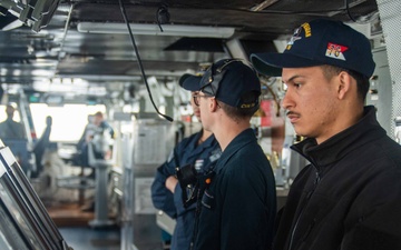 USS Ronald Reagan (CVN 76) Sailors stand watch in the pilot house