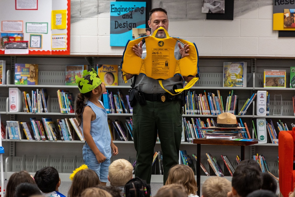 Park Ranger Demonstrates Life Jacket Safety to Kindergarteners