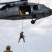 Members of EODMU 5 conduct a hoisting and rappelling exercise aboard USS Ronald Reagan (CVN 76)