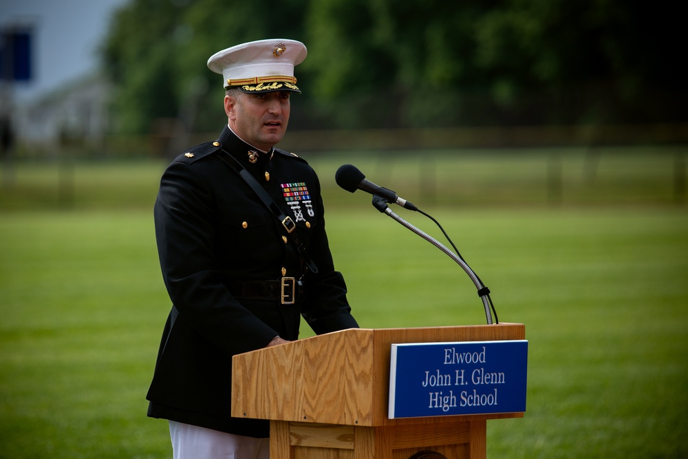 U.S. Marines with the Silent Drill Platoon and the Quantico Band interact with the students of Elwood.