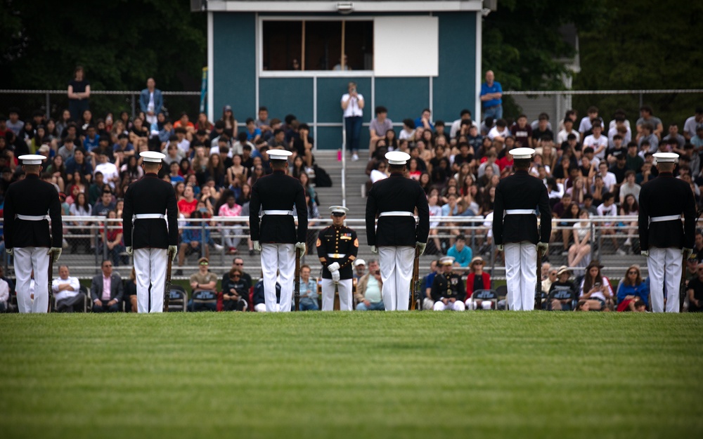 U.S. Marines with the Silent Drill Platoon and the Quantico Band interact with the students of Elwood.