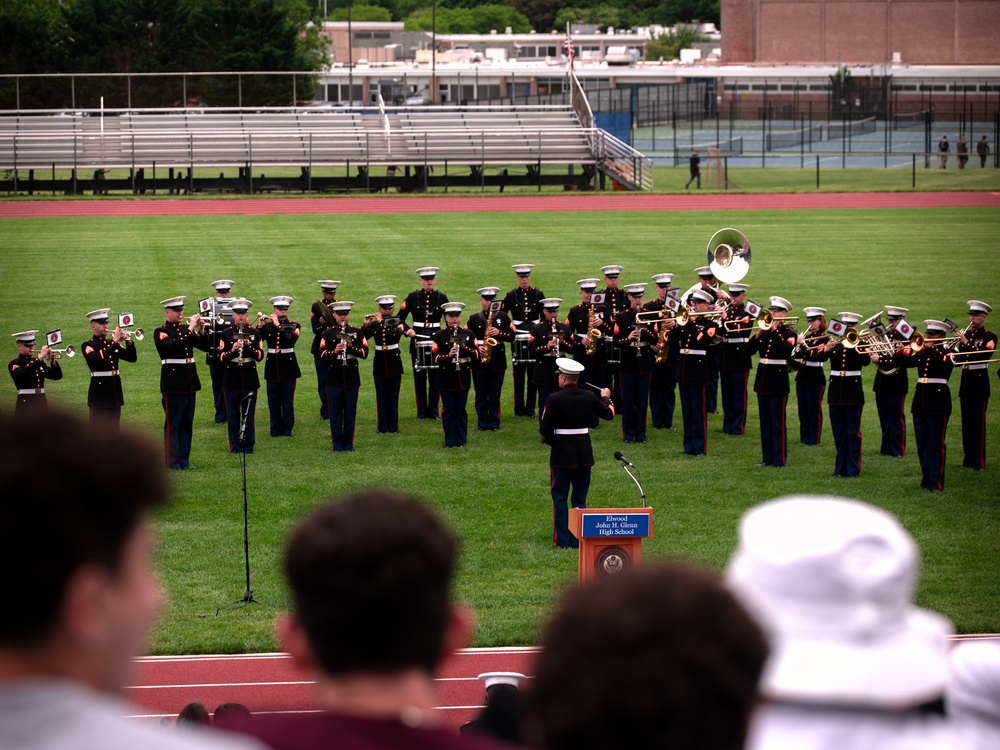 U.S. Marines with the Silent Drill Platoon and the Quantico Band interact with the students of Elwood.