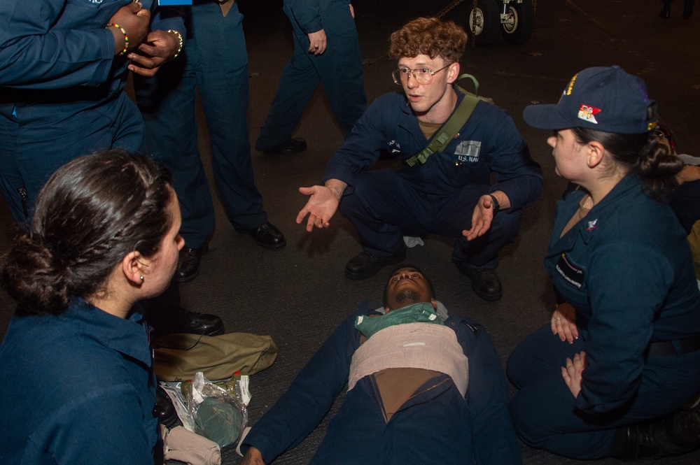 USS Ronald Reagan (CVN 76) Sailors train during a general quarters drill