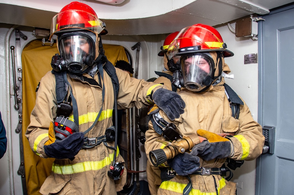 USS Ronald Reagan (CVN 76) Sailors train during a general quarters drill