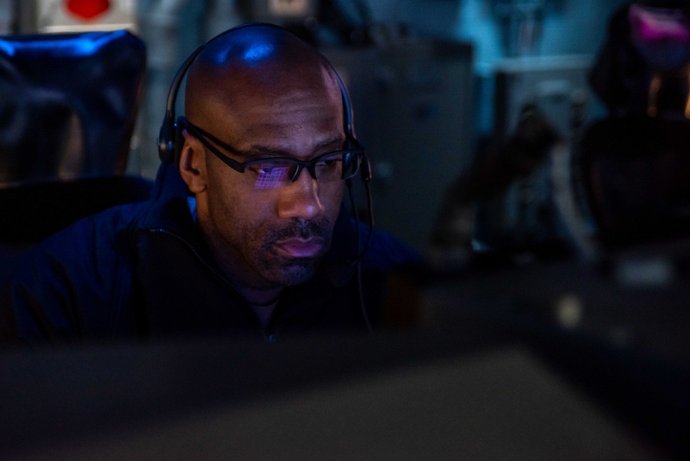 USS Ronald Reagan (CVN 76) Sailors monitor radars in the combat direction center