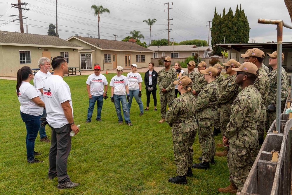 USS Carl Vinson (CVN 70) Sailors volunteer at the Boys and Girls Club of Fullerton, Richman Branch, with Disney VoluntEARS members during a community relations event during Los Angeles Fleet Week