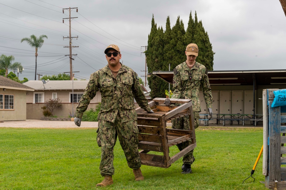 USS Carl Vinson (CVN 70) Sailors volunteer at the Boys and Girls Club of Fullerton, Richman Branch, with Disney VoluntEARS members during a community relations event during Los Angeles Fleet Week