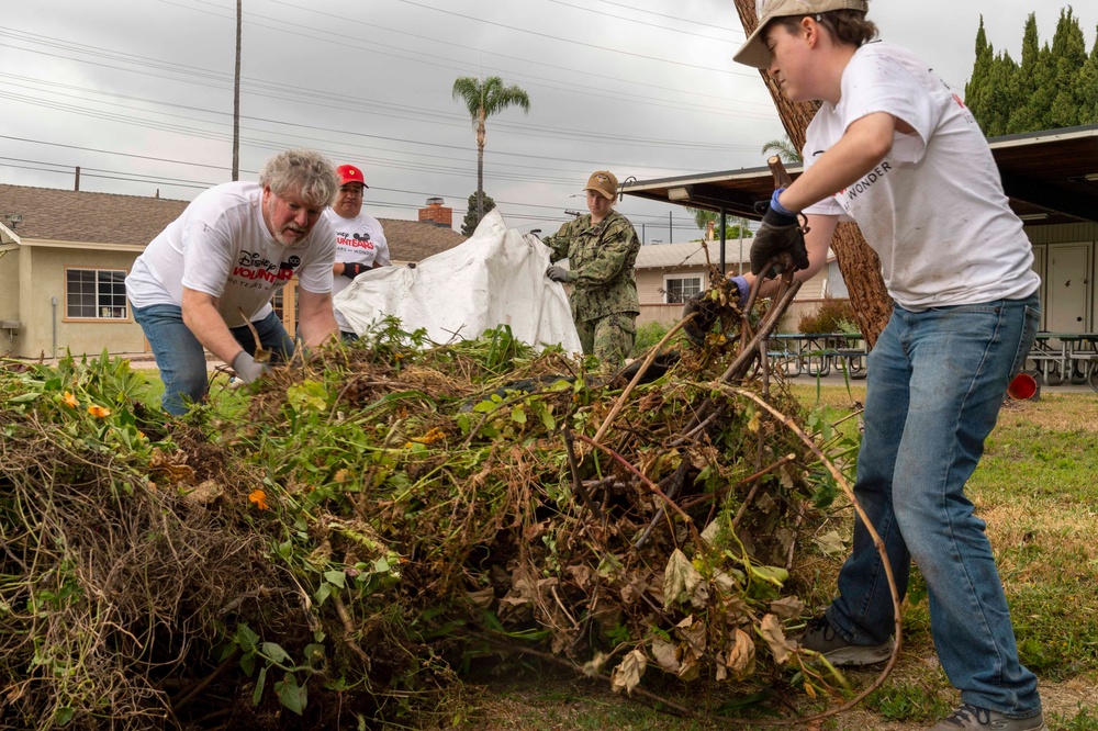 USS Carl Vinson (CVN 70) Sailors volunteer at the Boys and Girls Club of Fullerton  Richman Branch, with Disney VoluntEARS members during a community relations event during Los Angeles Fleet Week