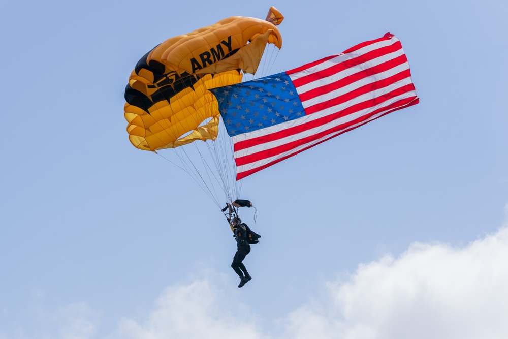 Army Golden Knights make parachute jump with American flag for the 108th Indy 500